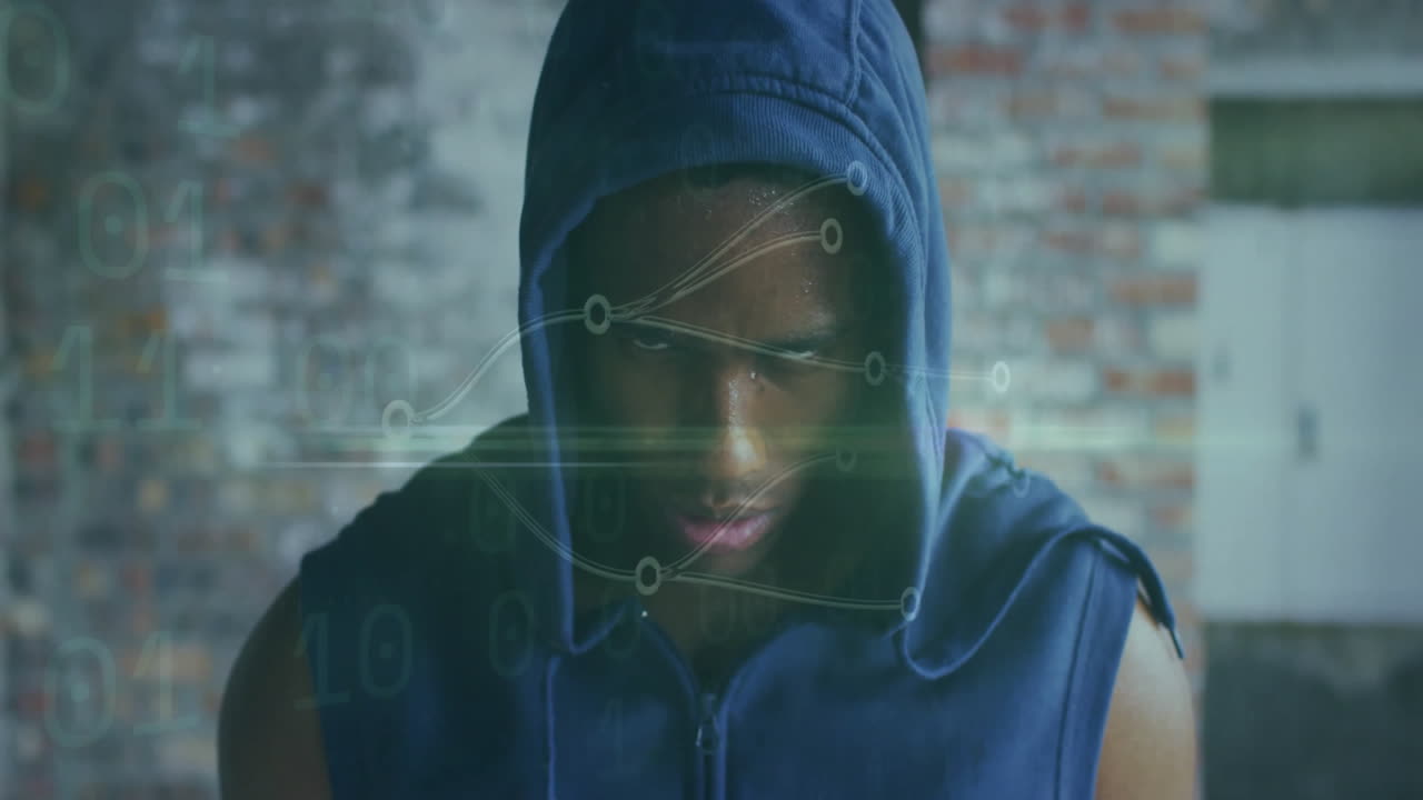 In animation, athlete wearing blue hoodie with digital data overlay on face
