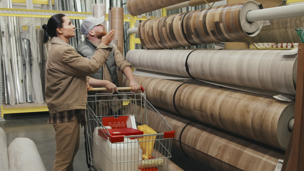 Man and Woman Choosing Linoleum at Store