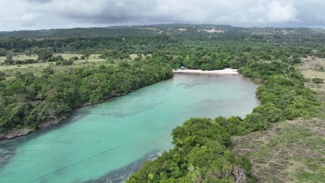 Playa-Caleton-bay-surrounded-lush-vegetation,-Rio-San-Juan-in-Dominican-Republic