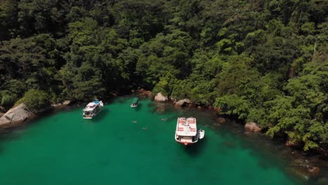 Aerial-Shot-Along-The-Turism-Boat-On-The-Coast