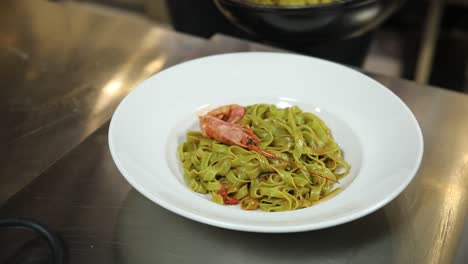 chef preparing shrimp and squid pasta