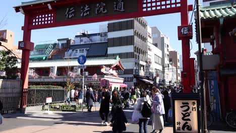 crowds navigate through a vibrant market gate