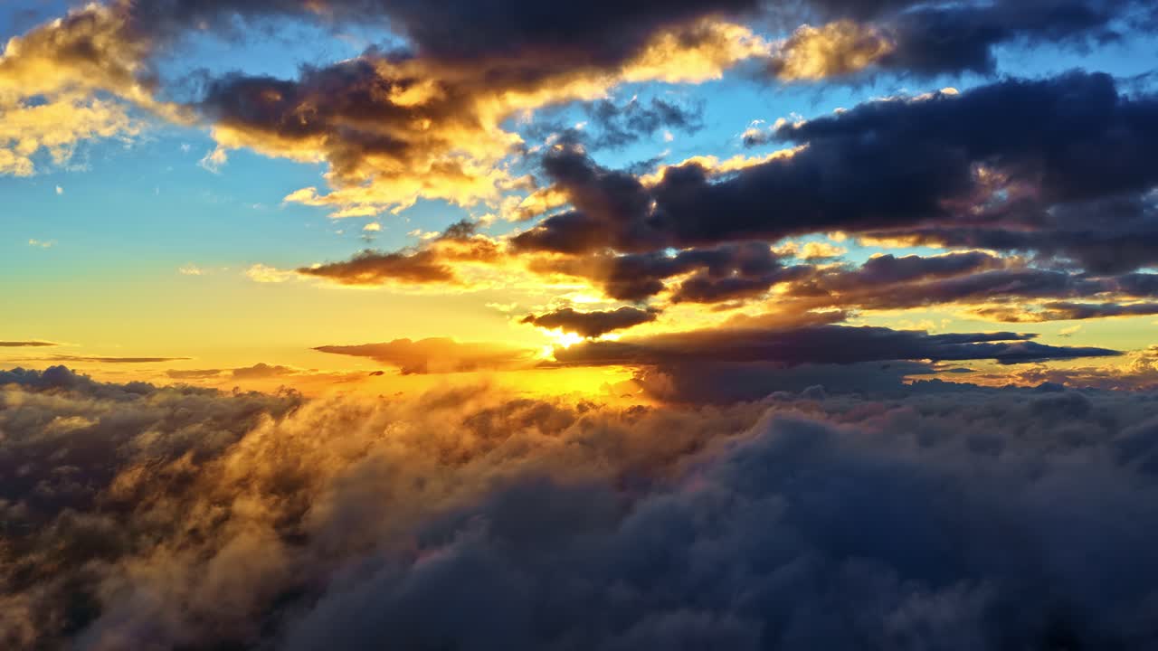 Dramatic Clouds Illuminated By Sunset Lights. Aerial Slow Motion Shot