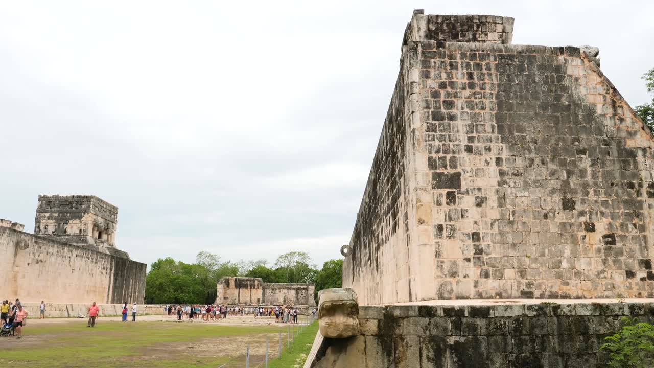 Tourists visiting The Great Ball Court in Chichen Itza.