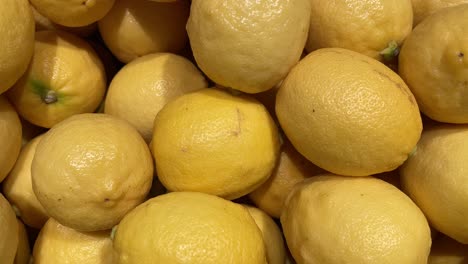 Top-view-close-up-of-a-pile-of-lemons-in-a-Supermarket