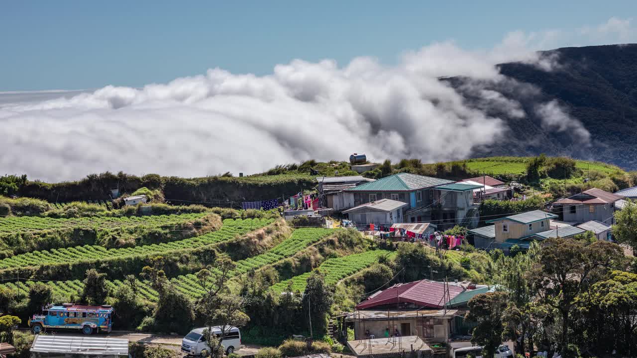 Sea of clouds on a town located on Mount Pulag, the third highest peak in Philippines.