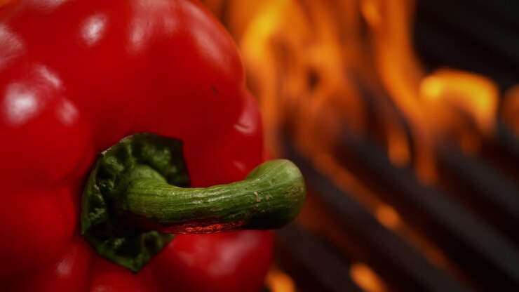 Bell Pepper Barbecued On A Grill, Roasted By The Flames Beneath The Grill Grate, Macro and Slow Motion