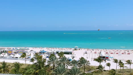 Aerial-view-of-beach-and-ocean-between-buildings