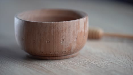 wooden bowl. close-up. healthy organic, wooden honey spoon, closeup.