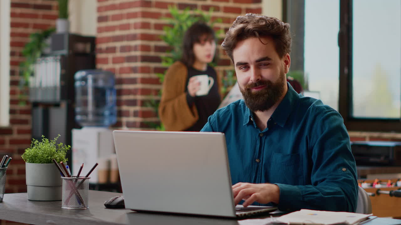 Portrait of project manager sending professional email on laptop