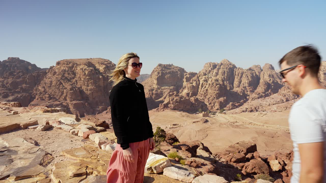 Young couple kissing at the panorama point at High Place of Sacrafice location, Petra, Jordan