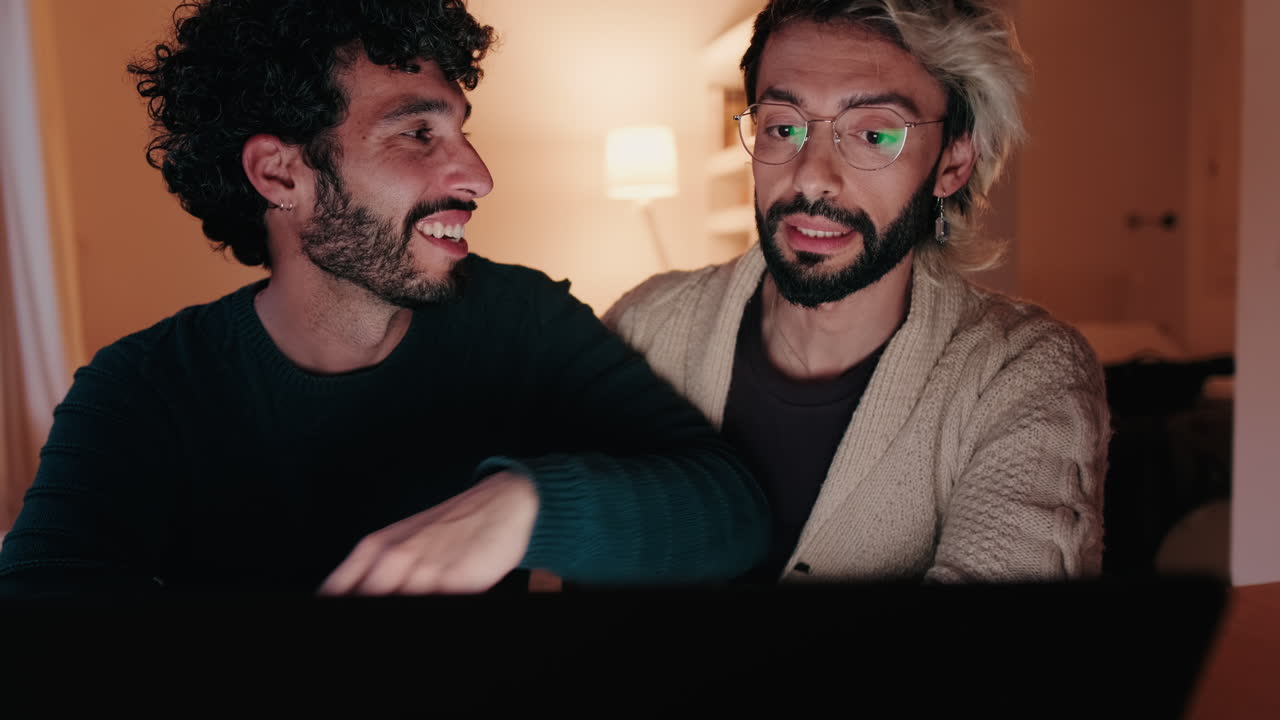 Gay Couple at Home with Laptop