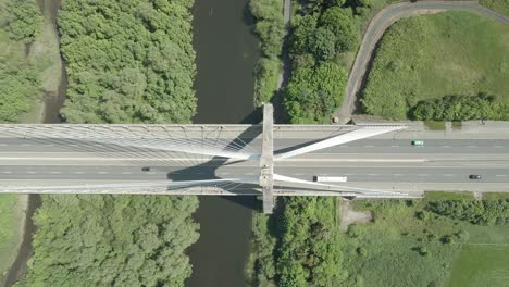 overhead view of cars driving on the mary mcaleese boyne valley bridge spanning the boyne river in county louth, ireland