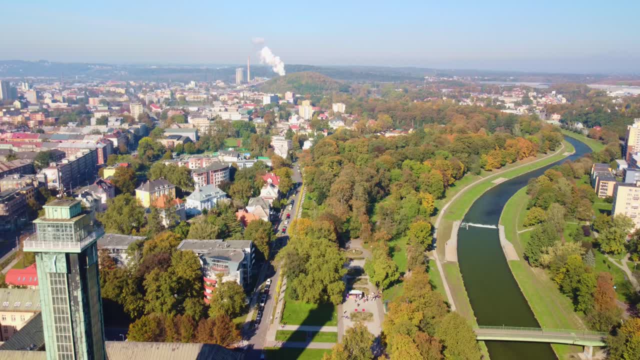 Aerial pullback of Komenskeho Park with Ostrava town hall in Czech Republic, autumn foliage and scenic view