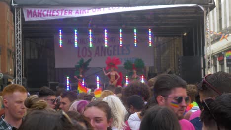 vibrant lgbtq+ pride celebration with stage performances and rainbow flags