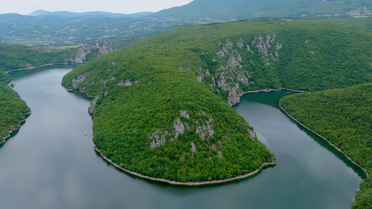 Aerial drone view of the Vrbas River in Bosnia and Herzegovina, flowing through green canyons and rocky cliffs a popular destination for rafting and nature travel