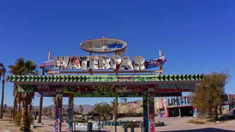 an aerial of an old waterpark sign with letters missing