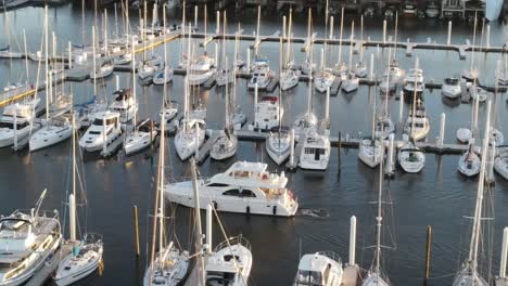 aerial view of yacht arrive at marina after cruising in the ocean