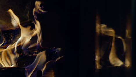 Slow-motion-shot-of-flames-and-embers-in-a-fireplace