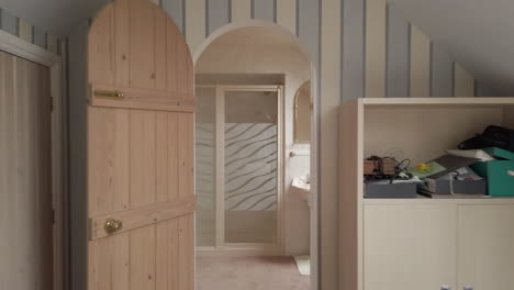 Reveal-Shot-of-an-Attic-Room-and-En-Suite-in-a-Family-Home-in-Slow-Motion