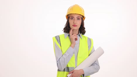 woman construction worker or engineer pondering with blueprint