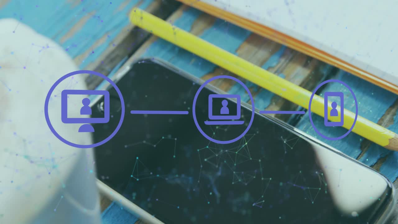 Animation of network of digital icons over pencil, smartphone and coffee cup on wooden surface