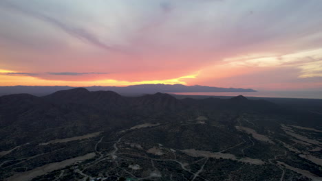 drone shot of deep sunset in ensenada de los muertos, beach in mexico