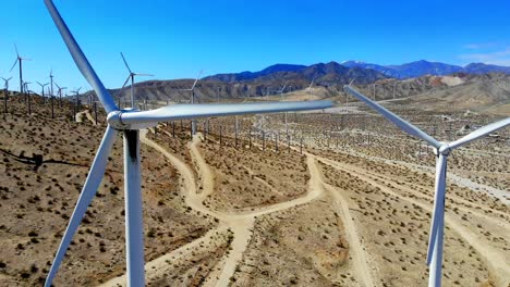 Close-up-spinning-blades-and-sweep-around-L-to-R,-windmills,-wind-turbines,-energy,-green,-renewable,-huge-power-generating-farm,-aerial-4k-drone,-Mt-San-Gorgonio,-Palm-Springs,-Coachella,-Cabazon