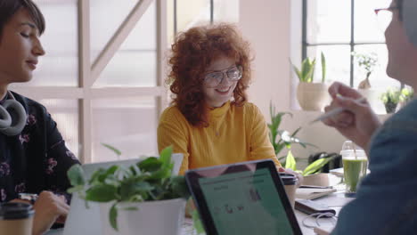 young-group-of-students-meeting-redhead-team-leader-woman-sharing-creative-ideas-enjoying-conversation-friends-discussing-business-project-in-modern-office-workplace