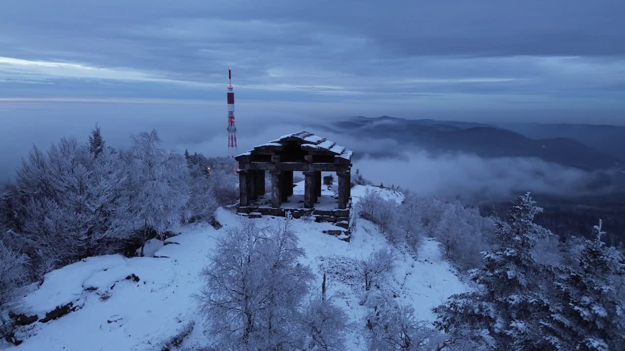 Drone footage of Temple du Donon covered in snow