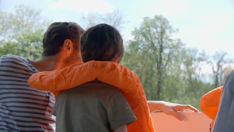 Father-And-Son-Enjoy-Ride-In-River-Boat-Shot-In-Slow-Motion