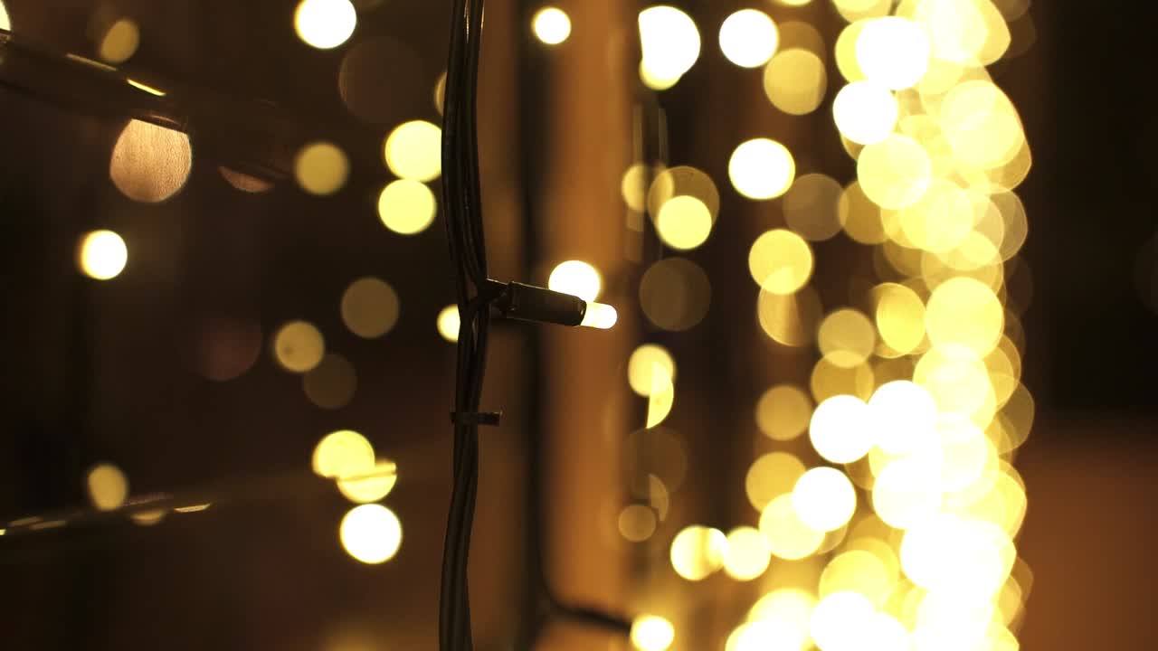Luminous Outdoor Lights Hanging By The Window At Night With Bokeh Effects