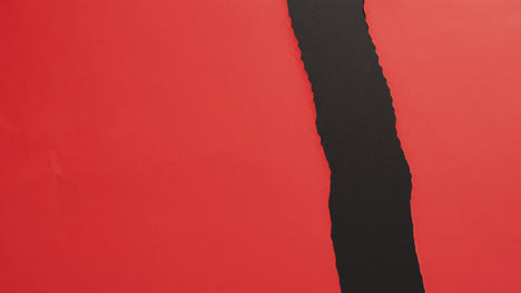 ripped black vertical stripe on red background