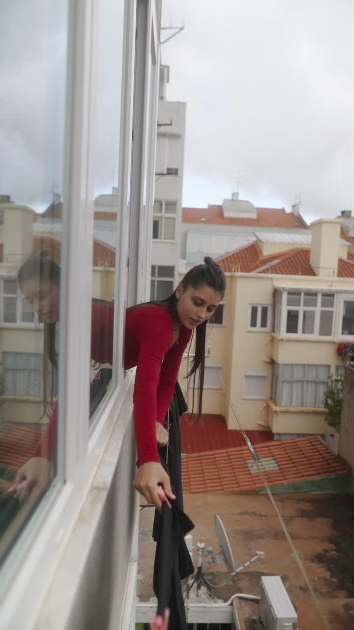Woman Hanging Clothes and Drying Clothes