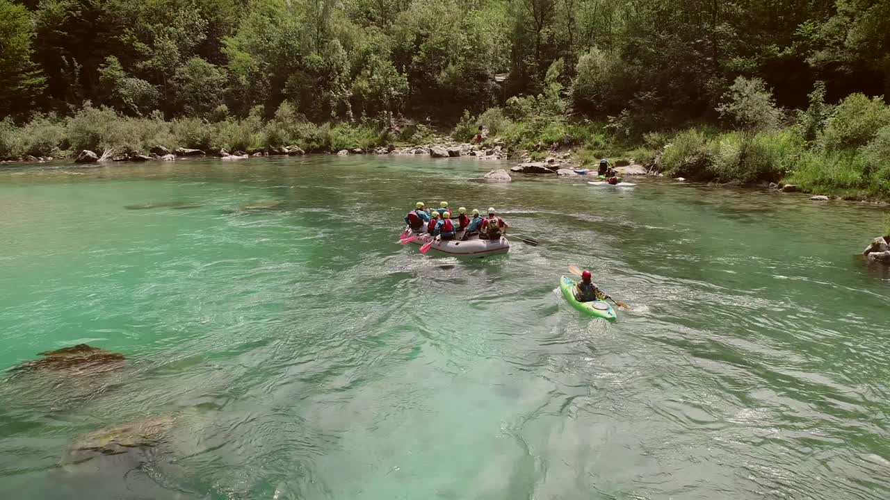 Aerial view of a group paddling in the rafting boat at the Soca River, Slovenia.