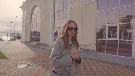 woman walking outdoors near a building