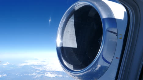 rear mounted turbofan jet engine view from airplane passenger window