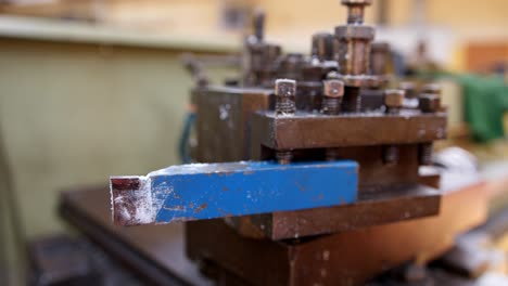 Slow-motion,-slider-shot-of-a-metal-turning-lathe