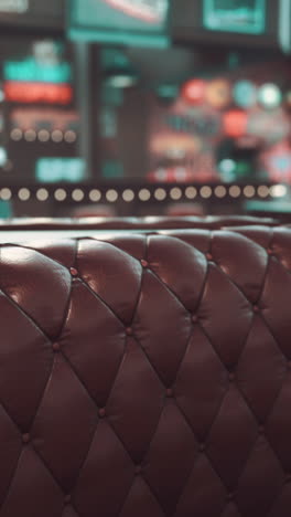 closeup of tufted leather upholstery on a restaurant booth