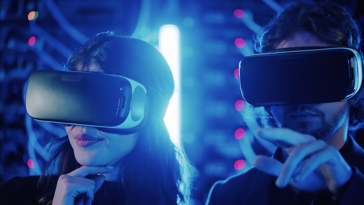 A man and a woman using Virtual Reality headsets in a server room