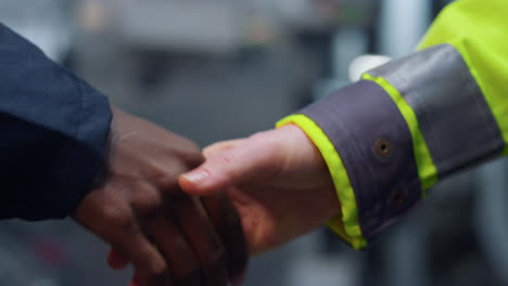 unknown ceo shaking hands at industrial factory closeup. successful agreement