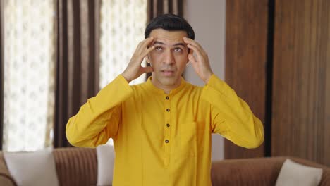 indian man suffering from headache