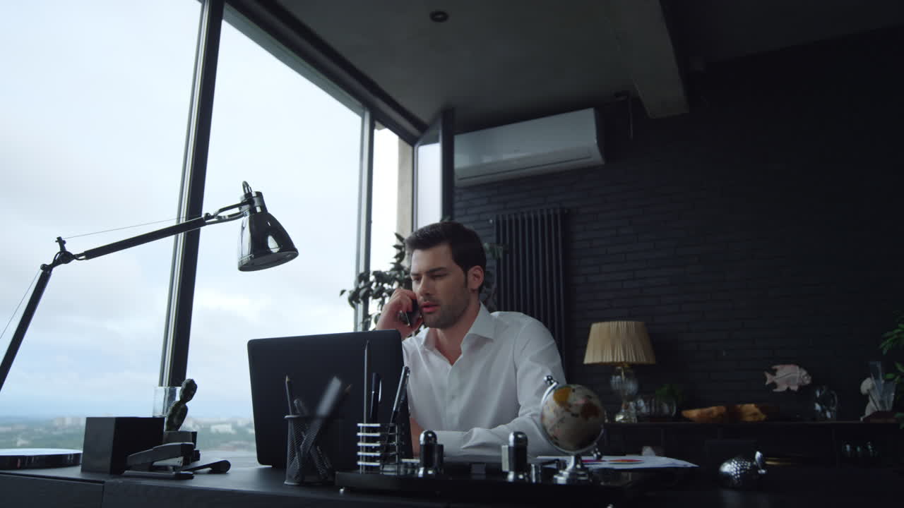 Manager talking on smartphone