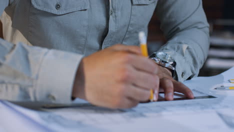 close up view of arabian man architect working with a pencil in a hand while drawing