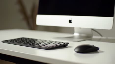 a sleek computer setup featuring a modern keyboard and mouse on a minimalistic desk – ideal workspace for productivity and creativity