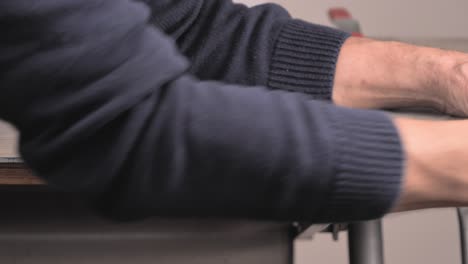 a man's hands planing vinyl floors to the desired size