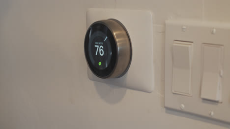 adjusting the temperature on a smart thermostat