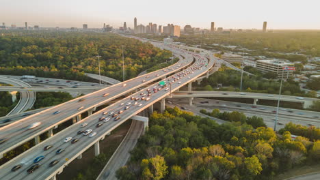 aerial drone hyperlapse fly above big urban highway intersection in houston usa interstate i10 and i610 freeway during daylight