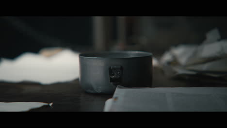 an intelligence officer takes ligter and cigarettes