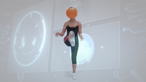 kicking orange ball, woman exercising over futuristic technology animation